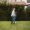 lady and kid playing at home lawn covered with shade trees