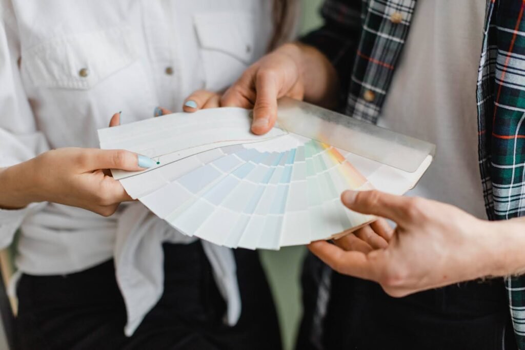 man and woman discussing paint options