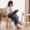 Woman using tab in a stylish chair