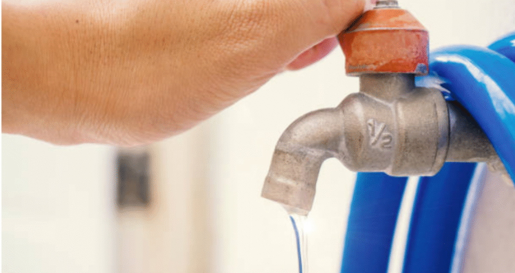 repairing outdoor faucet in summer