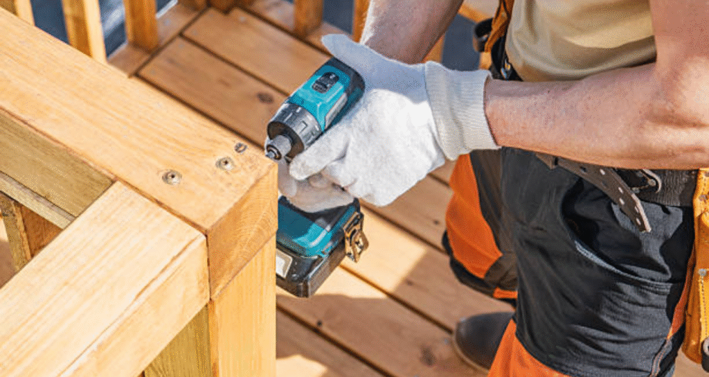 man constructing and maintaining a deck
