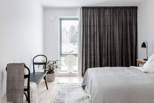 black curtain half open in bedroom