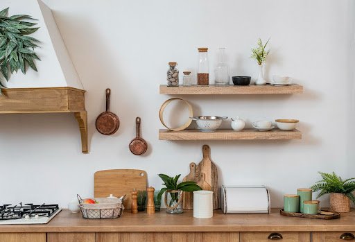 Wooden floating shelves in a modern small kitchen
