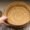 woman keeping tiered basket in small kitchen