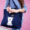 girl carrying tote bags