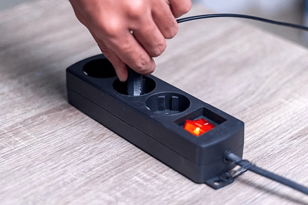 man putting switch in extension