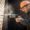 Person drilling into brick wall with hammer drill