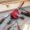 Manual hand drill on wooden workbench with tools