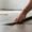 Close-up view of peel-and-stick vinyl flooring being installed