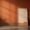rusty orange paint colors making room look dated